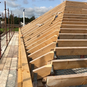 The wooden skeleton of a roof which is in the progress of being built