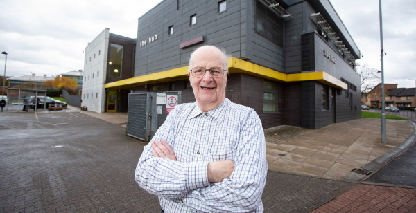 Man outside of Connect Community Trust building