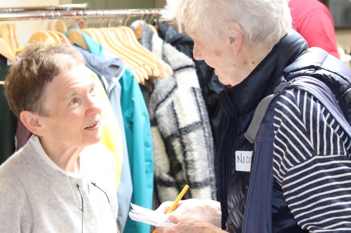 Two women exchanging email addresses