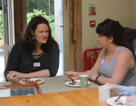 Nicola Hancock, volunteer, talking with a friend