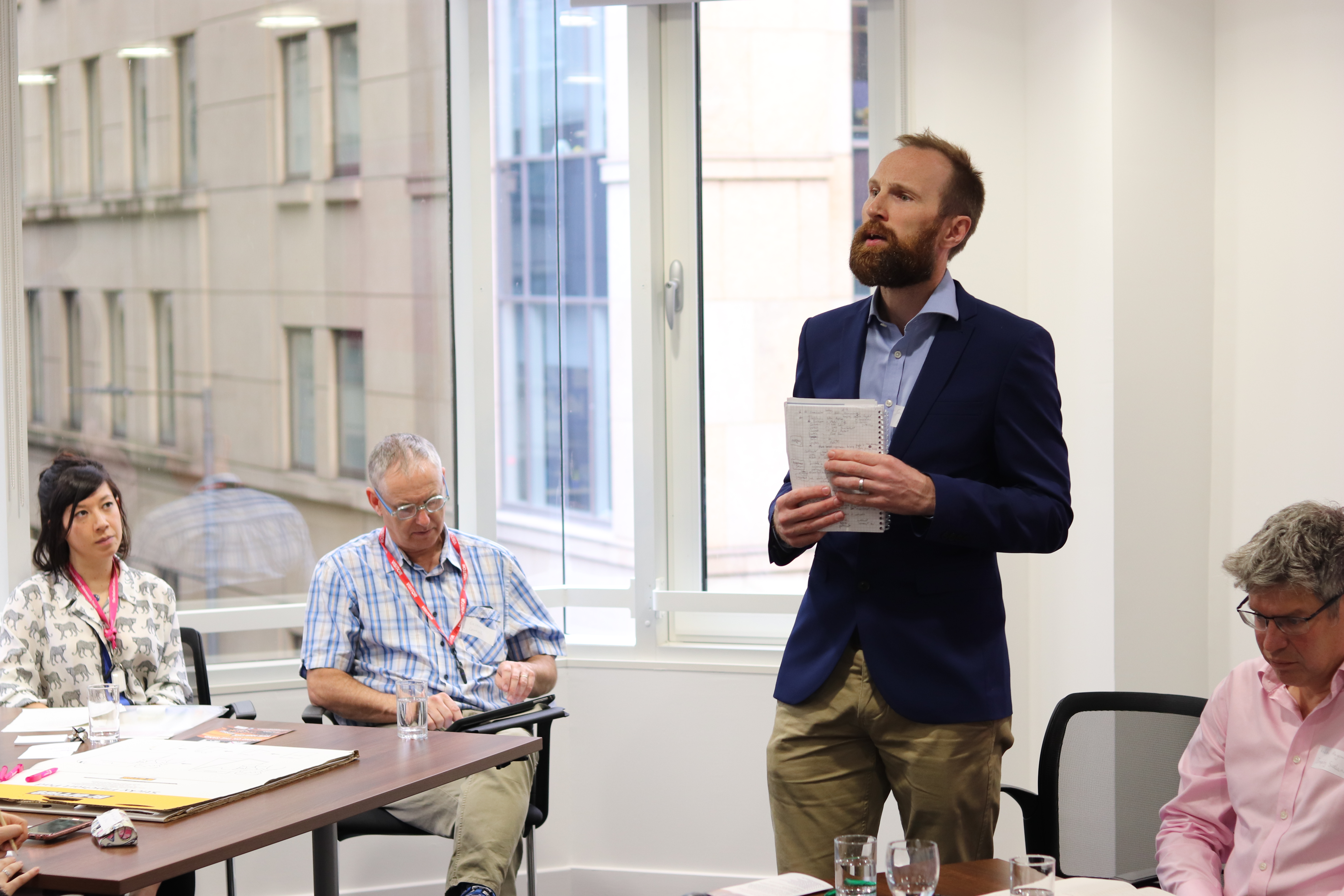 Someone standing talking to the room