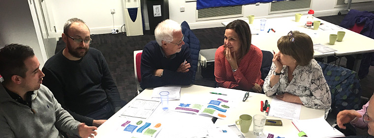 Participants ponder evaluation at October's "How's It Going?" session