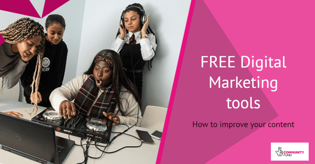 The group of young people gather round a laptop as they play around with a DJ deck. One listens through headphones as another looks in amazement at the screen.