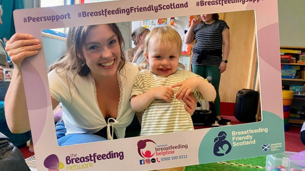 shannon with daughter in an indoor play area
